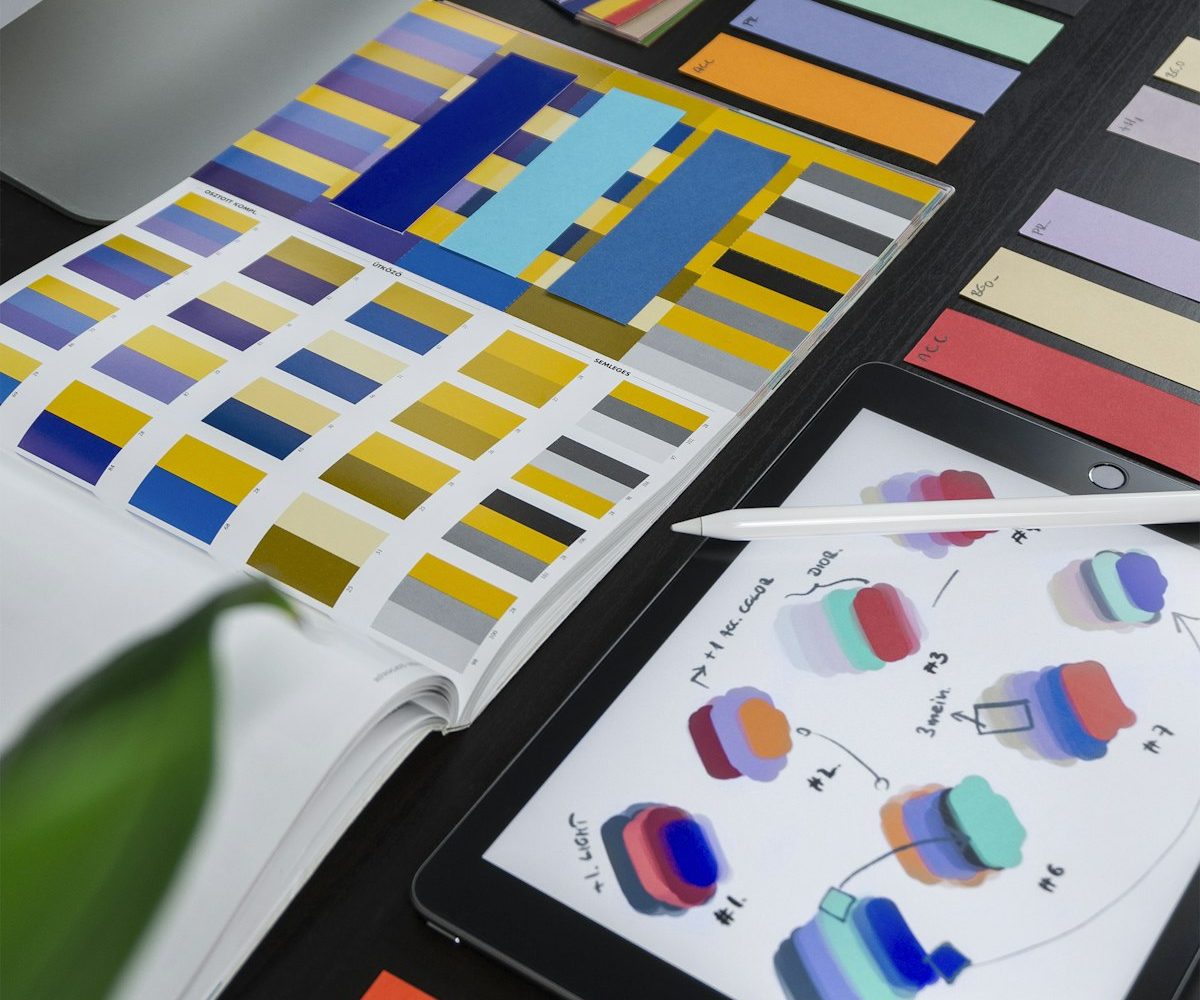 A designer workspace with brand and color materials